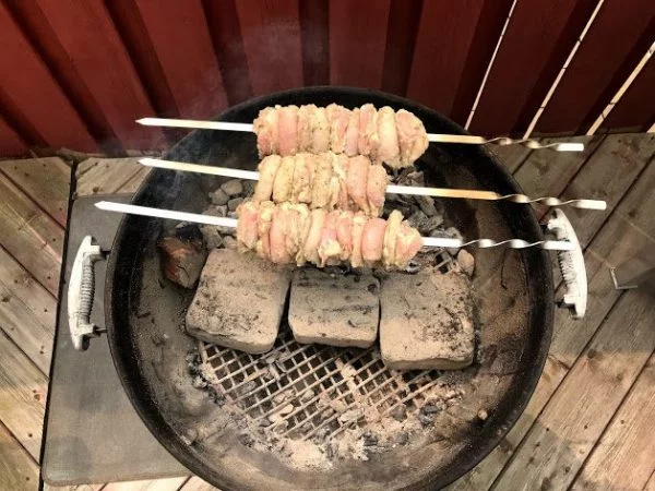 Chicken shashlik being grilled over hot coals