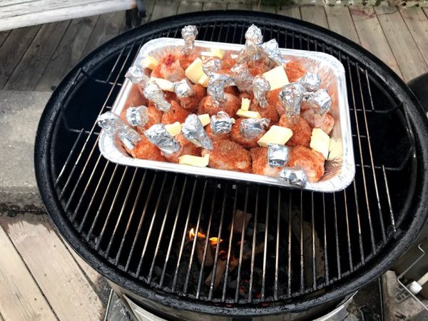 putting Chicken Lollipops on smoker